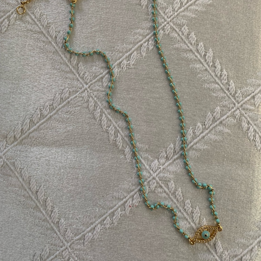 J Crew Mexican eye charm with petite turquoise blue beads